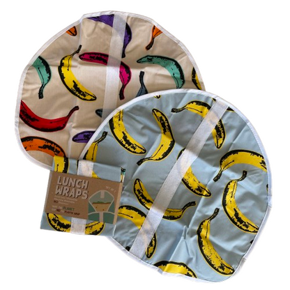 Two pop art banana print lunch wraps and a set packaged up alongside them.