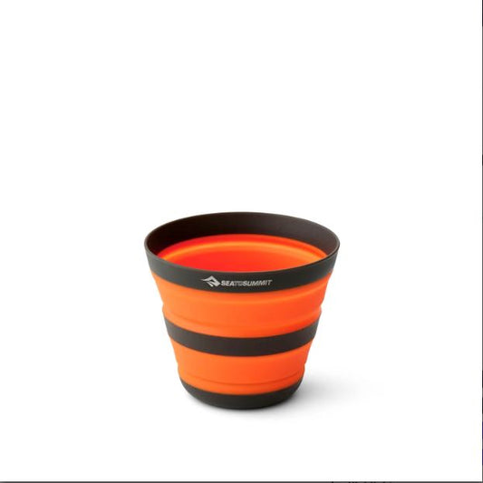 Orange Sea to Summit collapsible cup with black bands.