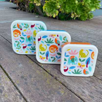 Trio of snack boxes featuring jungle animals on the lids.