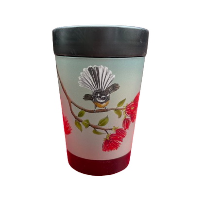 Black reusable coffee cup with a blue grey wrap around the centre with a fantail resting on a pohutukawa branch.