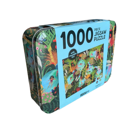 Beautiful rectangle tin sitting on it's side depicting artwork called Wahine in Water. A bright river and forest scene with native NZ birds and trees and women swimming. Inside is a 100 piece jigsaw puzzle with the same image.