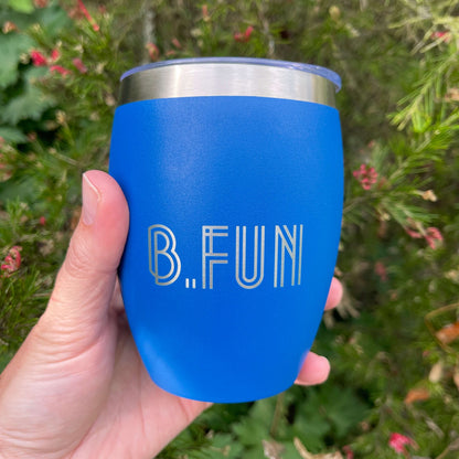 Bright blue stainless coffee mug with B.FUN engraved into it.