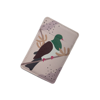 Small closed pocket mirror with a Kereru bird painted on it.