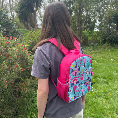 Bright pink childs backpack with blue front and princess pictures.