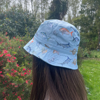 Bucket hat with NZ fish printed on it.