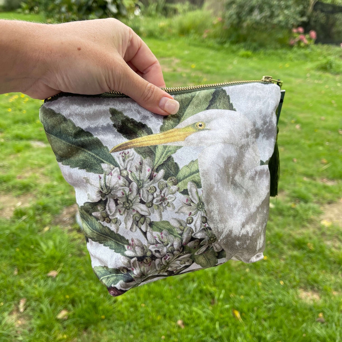 Velvet cosmetic bag with a white heron and botanical print.